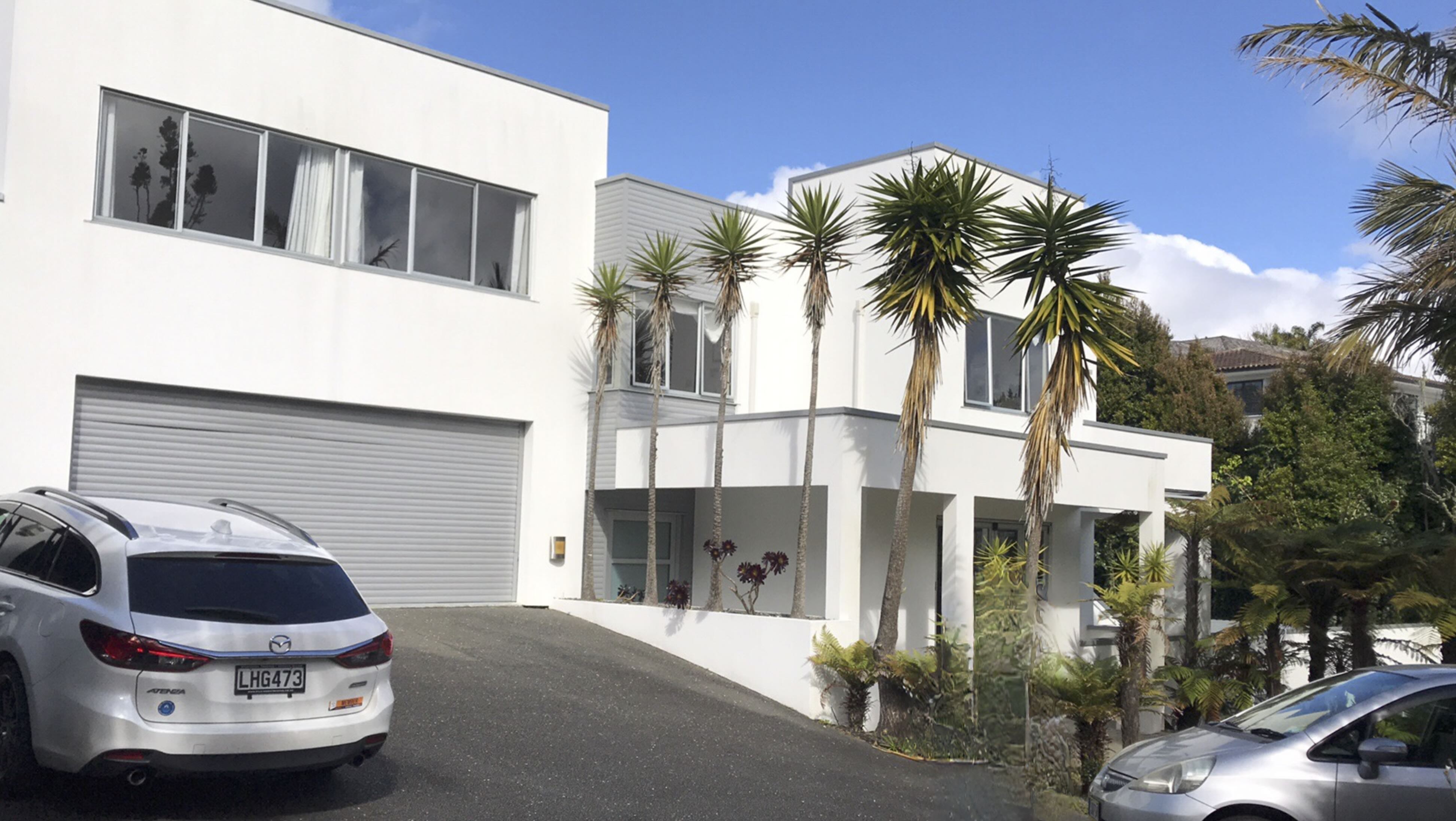 Modern White House with Palm Trees